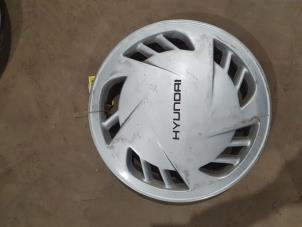 Begagnade Hjulskydd (reserv) Hyundai S-coupe 1.5i GS,GT,GTX Pris € 10,00 Marginaltabell erbjuds av F. van den Mosselaar autodemontage