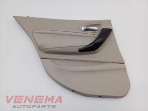 Gebruikte Deurbekleding 4Deurs links-achter BMW 1 serie (F20) 116i 1.6 16V Prijs € 24,99 Margeregeling aangeboden door Venema Autoparts