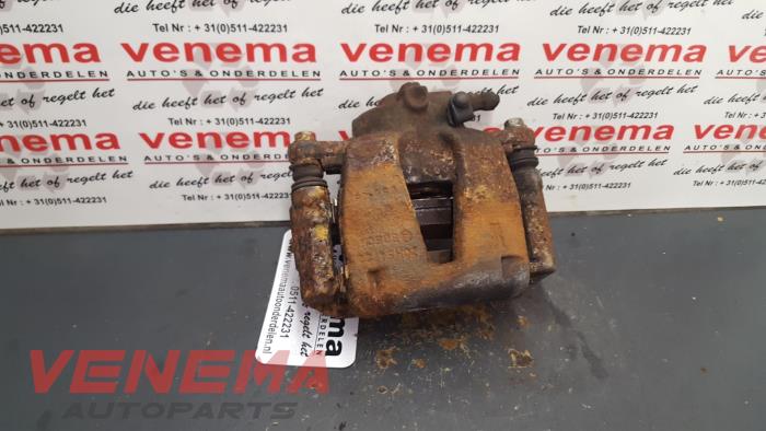 Främre bromsok, vänster från en Opel Corsa D 1.2 16V 2009