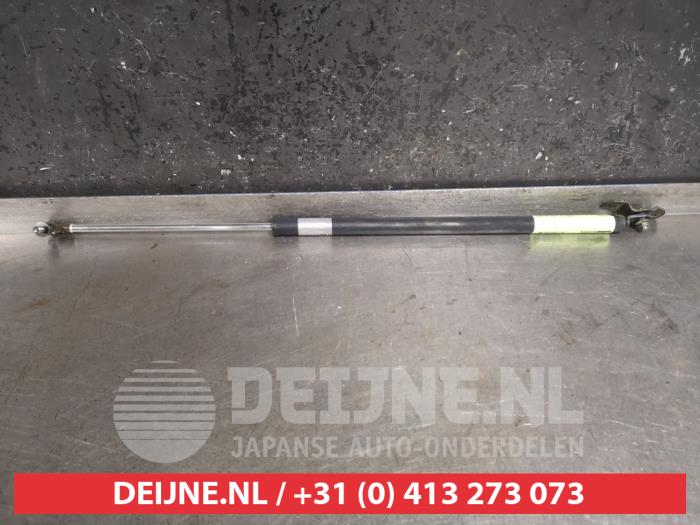 Kofferdekseldemper links-achter van een Honda HR-V (GH) 1.6 16V 4x4 2000