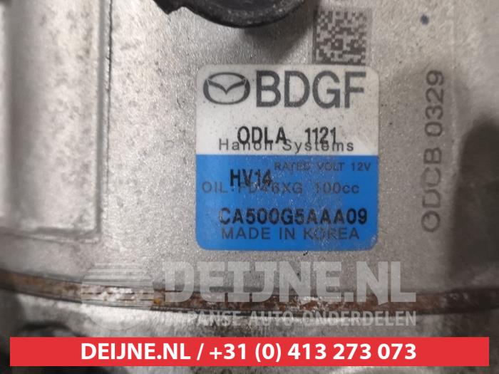 Luftkonditioneringspump från en Mazda 3 (BP) 2.0 SkyActiv-G 122 M Hybrid 16V 2019