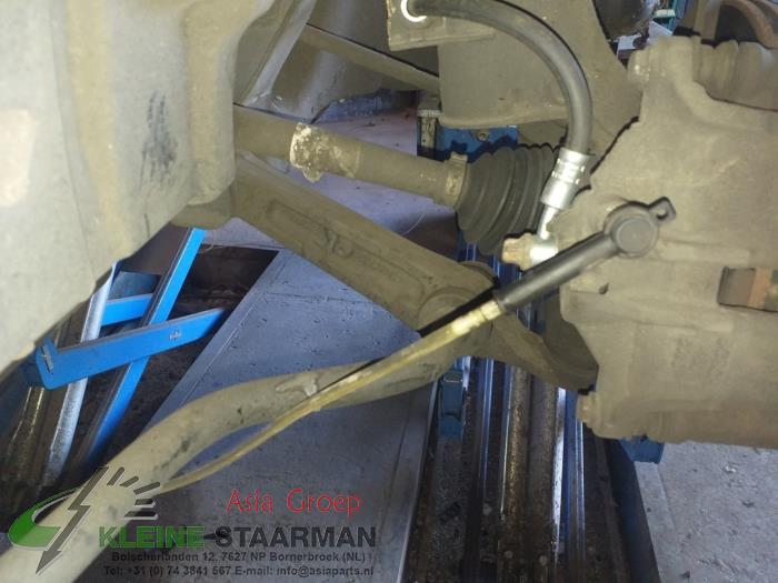 Drivaxel, vänster fram från en Suzuki New Ignis (MH) 1.5 16V 2005