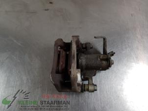 Używane Zacisk hamulcowy lewy tyl Kia Picanto (JA) 1.0 12V Cena € 70,00 Procedura marży oferowane przez Kleine Staarman B.V. Autodemontage