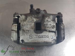 Gebruikte Remklauw (Tang) rechts-voor Mazda CX-30 (DM) 2.0 e-SkyActiv X 186 M Hybrid 16V Prijs € 50,00 Margeregeling aangeboden door Kleine Staarman B.V. Autodemontage