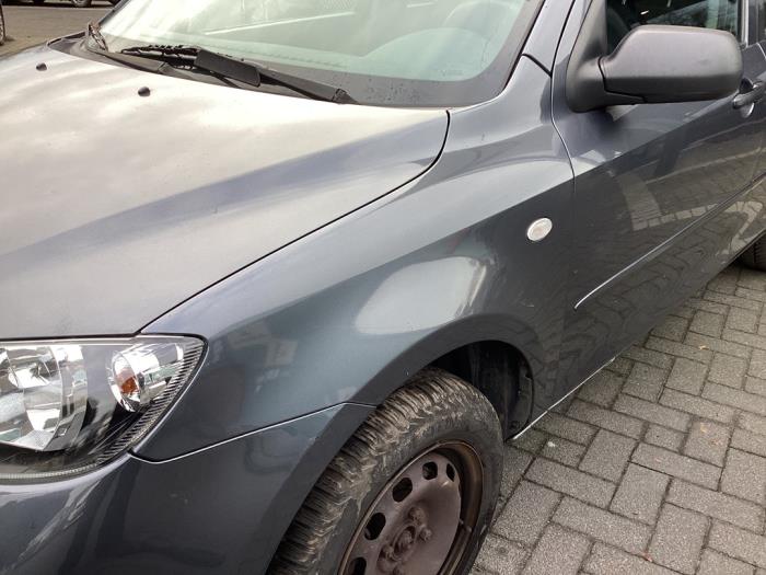 Framskärm, vänster från en Mazda 2 (NB/NC/ND/NE) 1.4 16V 2005