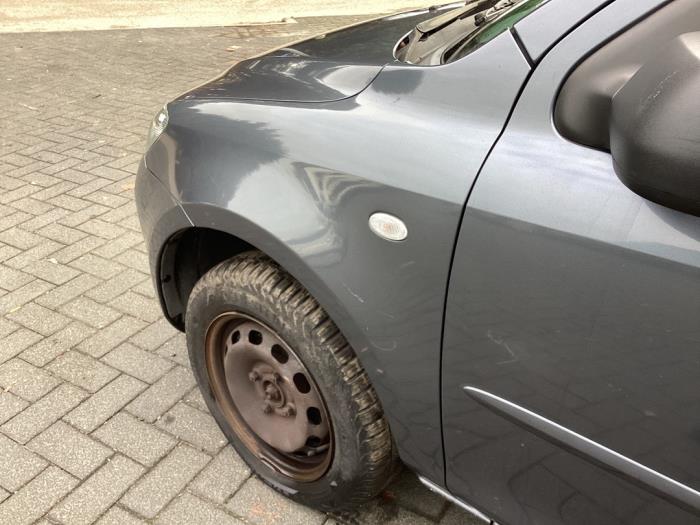 Framskärm, vänster från en Mazda 2 (NB/NC/ND/NE) 1.4 16V 2005