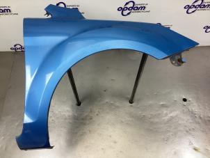 Używane Blotnik prawy przód Ford Focus 2 Wagon 1.4 16V Cena € 90,00 Procedura marży oferowane przez Gebr Opdam B.V.