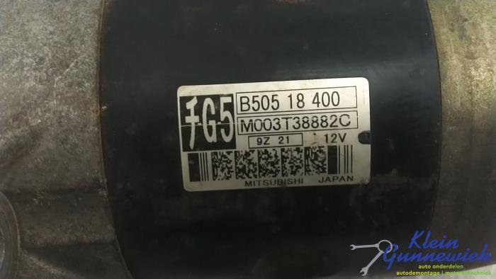 Startmotor från en Mazda 323F 2000