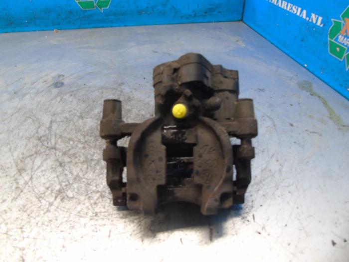 Bakre bromsok, vänster från en Audi A3 Sportback (8VA/8VF) 1.6 TDI Ultra 16V 2014