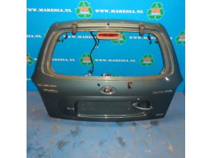Begagnade Baklucka Hyundai Santa Fe I 2.4 16V 4x4 Pris € 78,75 Marginaltabell erbjuds av Maresia Auto Recycling B.V.