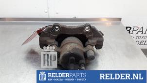 Używane Zacisk hamulcowy lewy przód Mazda 5 (CWA9) 2.0i 16V Cena € 45,00 Procedura marży oferowane przez Relder Parts B.V.