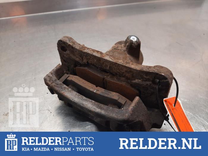 Bakre bromsok, vänster från en Toyota Land Cruiser (J12) 3.0 D-4D 16V 2003