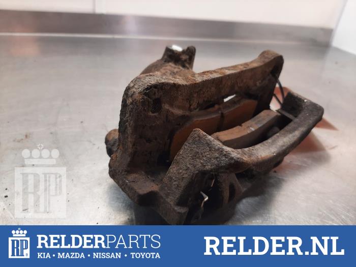 Bakre bromsok, vänster från en Toyota Land Cruiser (J12) 3.0 D-4D 16V 2003