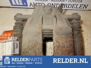 Używane Zacisk hamulcowy lewy przód Nissan Note (E11) 1.4 16V Cena € 25,00 Procedura marży oferowane przez Relder Parts B.V.