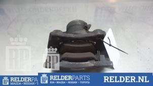 Używane Zacisk hamulcowy prawy przód Nissan Note (E11) 1.4 16V Cena € 25,00 Procedura marży oferowane przez Relder Parts B.V.