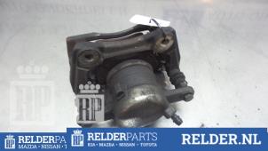 Używane Zacisk hamulcowy lewy przód Nissan Note (E11) 1.4 16V Cena € 25,00 Procedura marży oferowane przez Relder Parts B.V.