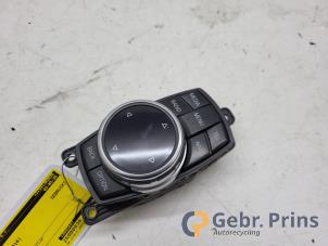 Używane Przycisk I-Drive BMW 3 serie Touring (F31) 330d 3.0 24V Cena € 75,00 Procedura marży oferowane przez Autorec. Gebr. Prins b.v.
