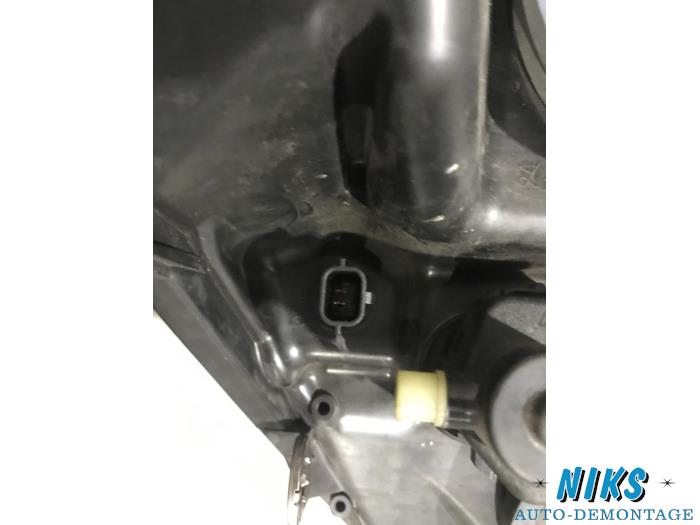 Koplamp rechts van een Renault Scénic II (JM) 1.6 16V 2004