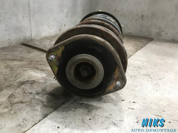 Front shock absorber rod, right from a Opel Corsa B (73/78/79) 1.4i 1997