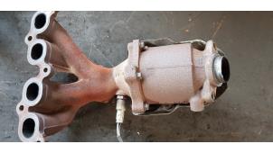 Używane Kolektor wydechowy + katalizator Nissan Note (E11) 1.4 16V Cena € 125,00 Procedura marży oferowane przez Autosloopbedrijf H.C.Stouten