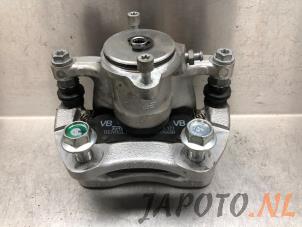 Gebruikte Remklauw (Tang) links-achter Nissan Juke (F16) 1.0 DIG-T 12V Prijs € 120,94 Inclusief btw aangeboden door Japoto Parts B.V.