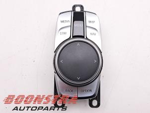 Używane Przycisk I-Drive BMW 7 serie (G11/12) 740e,Le xDrive Cena € 109,95 Procedura marży oferowane przez Boonstra Autoparts