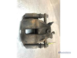 Używane Zacisk hamulcowy prawy przód Nissan Note (E11) 1.4 16V Cena € 25,00 Procedura marży oferowane przez Autobedrijf Brooks