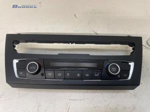 Gebruikte Chaufage Bedieningspaneel BMW 1 serie (F20) 114i 1.6 16V Prijs € 100,00 Margeregeling aangeboden door Autobedrijf Brooks