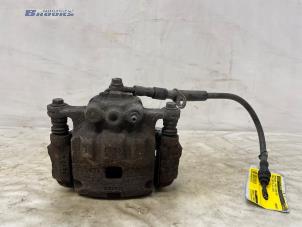 Gebruikte Remklauw (Tang) links-voor Ford Fiesta 6 (JA8) 1.0 SCI 12V 80 Prijs € 12,50 Margeregeling aangeboden door Autobedrijf Brooks