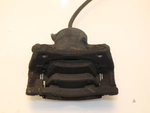 Begagnade Främre bromsok, vänster Dacia Logan MCV (KS) 1.6 16V Pris € 43,00 Marginaltabell erbjuds av Van Gils Automotive