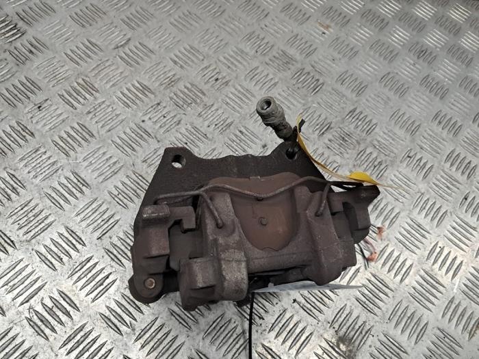 Bakre bromsok, vänster från en Volkswagen Golf VII (AUA) 1.6 TDI 16V 2014