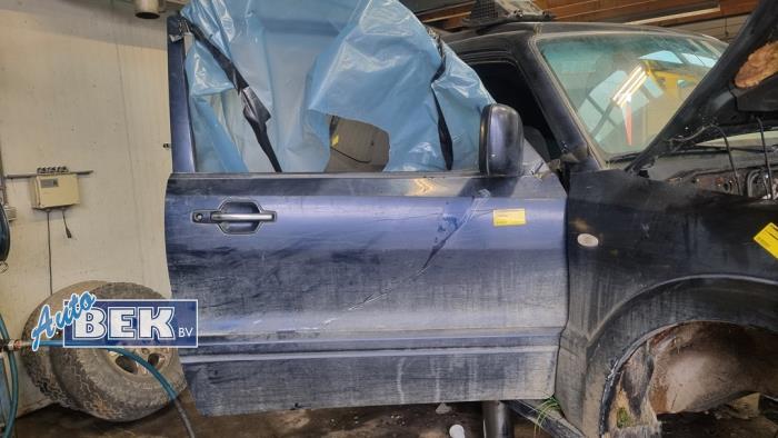 Dörr, 2-dörrars, höger från en Mitsubishi Pajero Hardtop (V8/9) 3.2 DI-D 16V 2006