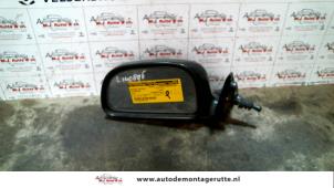 O85418 Gebruikte spiegel buiten links Mitsubishi Colt