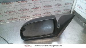 O85021 Gebruikte buitenspiegel links Kia Carens