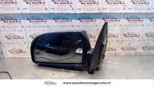 O85019 Gebruikte buitenspiegel links Kia Carens