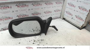 O85738 Gebruikte buitenspiegel links Toyota Starlet