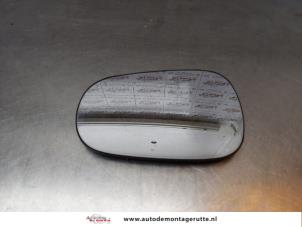 Gebruikte Spiegelglas links Dacia Logan (LS) 1.6 Prijs op aanvraag aangeboden door Autodemontage M.J. Rutte B.V.