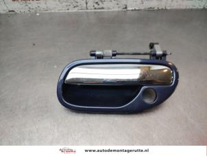 O195490 Gebruikte deurgreep 4deurs links-voor Volvo S40