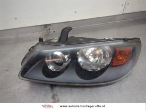 O195640 Gebruikte koplamp links Nissan Almera