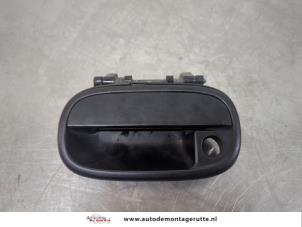 O195679 Gebruikte portiergreep 4deurs links-voor Suzuki Alto