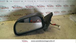 O85424 Gebruikte spiegel buiten links Mitsubishi Colt