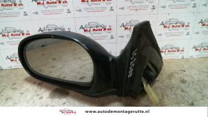 O85026 Gebruikte buitenspiegel links Kia Shuma
