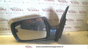 O85036 Gebruikte spiegel buiten links Kia Carnival