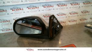 O85029 Gebruikte buitenspiegel links Kia Shuma