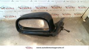 O85425 Gebruikte spiegel buiten links Mitsubishi Colt