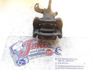 Begagnade Bakre bromsok, vänster Mini Mini (R56) 1.6 One D 16V Pris på förfrågan erbjuds av Autodemontage Joko B.V.