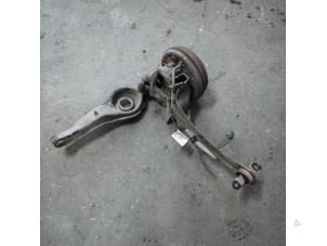 Begagnade Bakre upphängning, vänster Ford Focus 2 1.8 16V Pris på förfrågan erbjuds av Autodemontage Joko B.V.