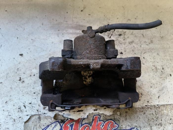 Främre bromsok, höger från en Opel Zafira (M75) 2.2 16V Direct Ecotec 2008