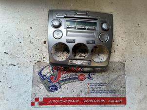 Begagnade Radiokontrollpanel Mazda 2 (NB/NC/ND/NE) 1.4 16V Pris på förfrågan erbjuds av Autodemontage Joko B.V.