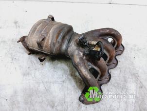 Używane Kolektor wydechowy + katalizator Volkswagen Polo IV (9N1/2/3) 1.4 16V 75 Cena € 250,00 Procedura marży oferowane przez Autodemontagebedrijf De Mars